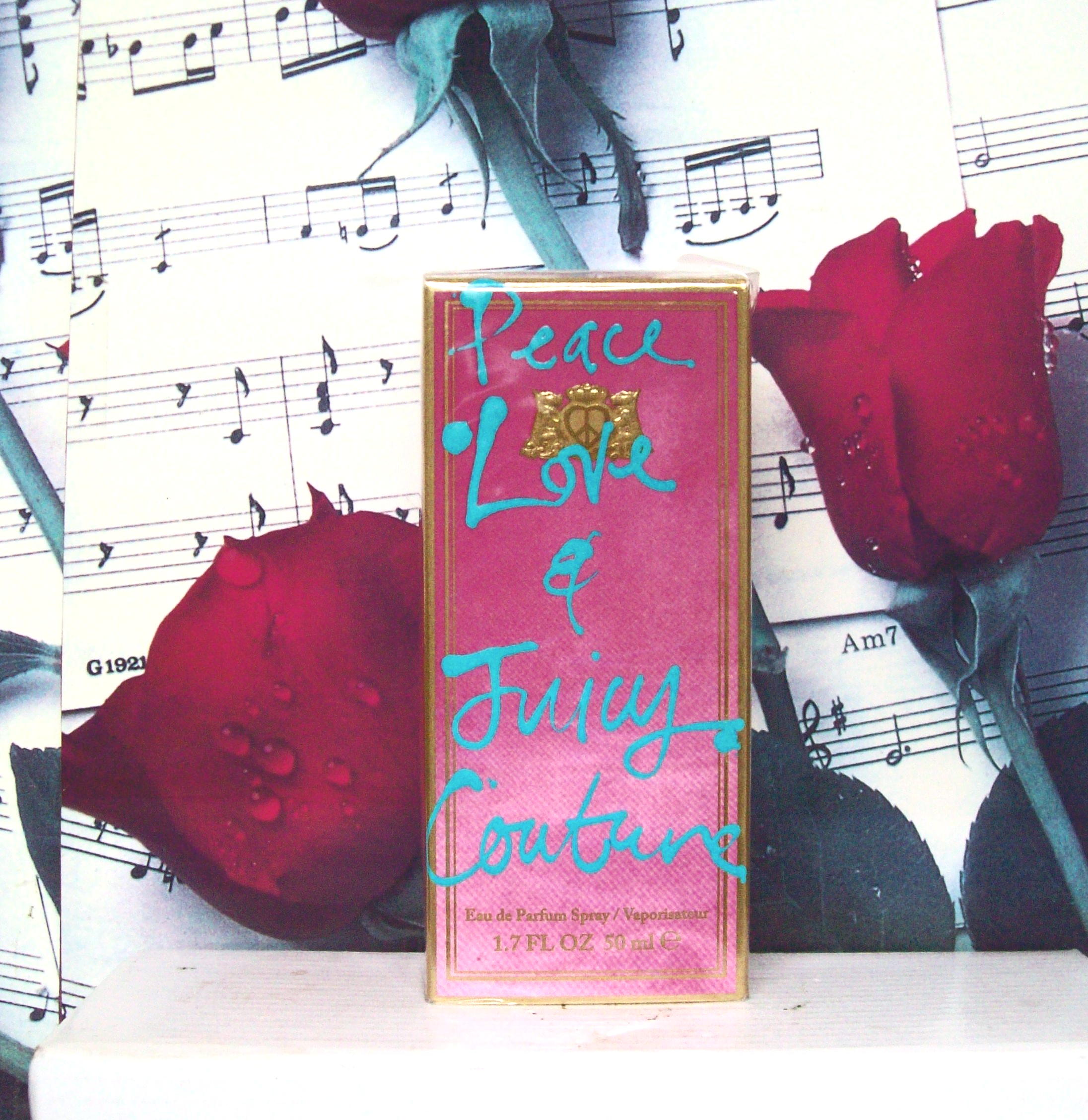 Peace Love and Juicy Couture 1.7 oz perfume bottle with box